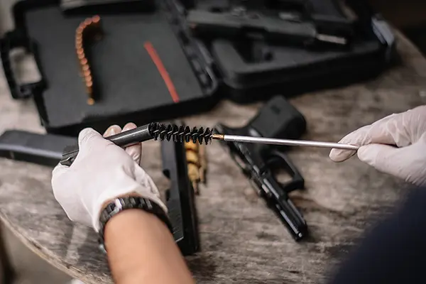 Gunsmith cleaning gun