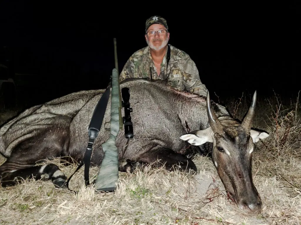 Hunter with deer