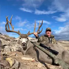 R. Moore with mule deer